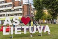 Woman and sign saying Ã¢â¬ÂI love LithuaniaÃ¢â¬Â in Klaipeda